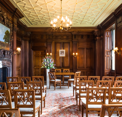 Photo of the Mahogany parlour in Goldney house set up ceremony style for a wedding ceremony. 